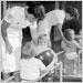 Two children with polio receiving physical therapy